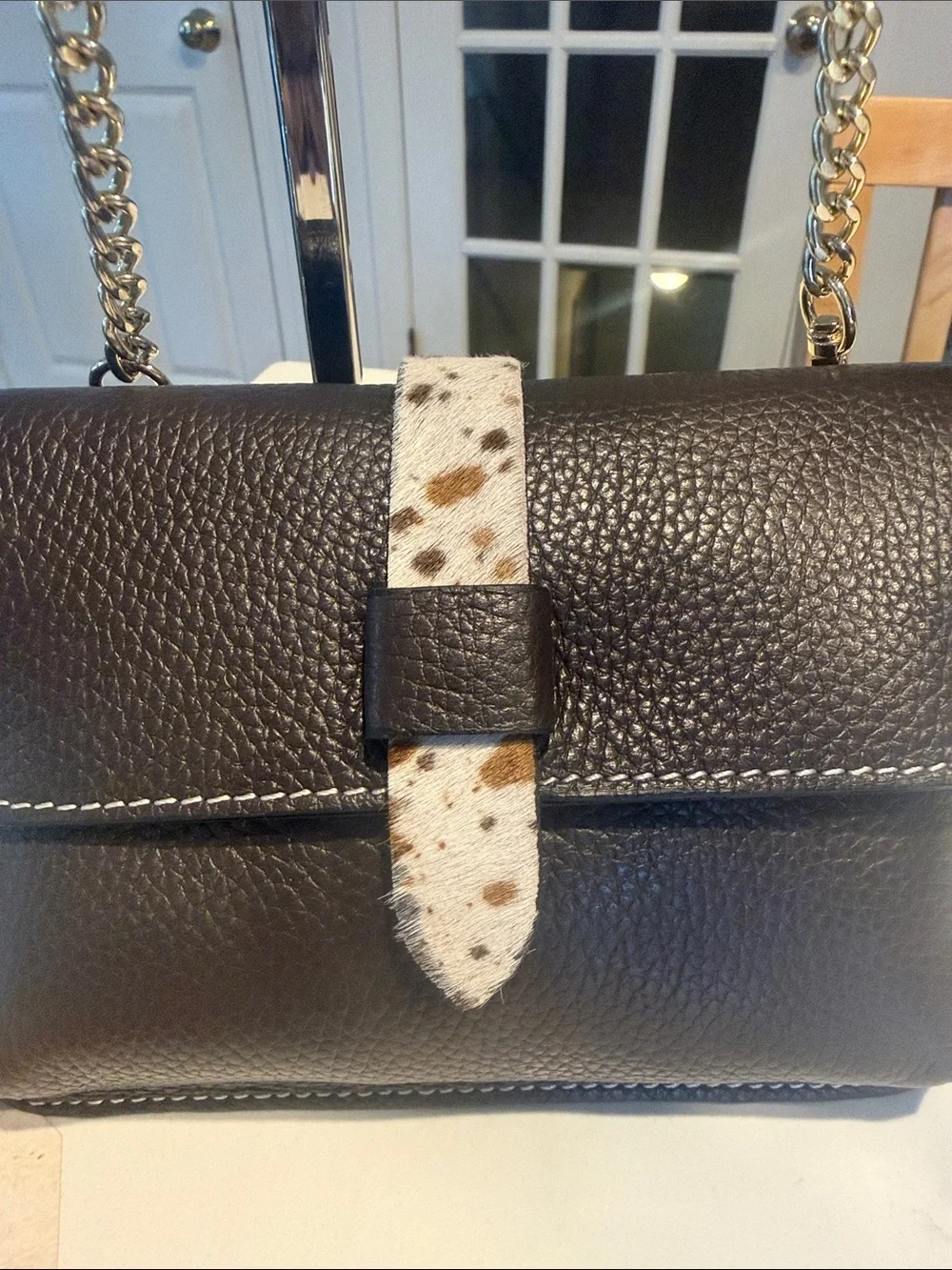 Black Pebbled Leather Crossbody Bag with Speckled Tab and Gold Chain